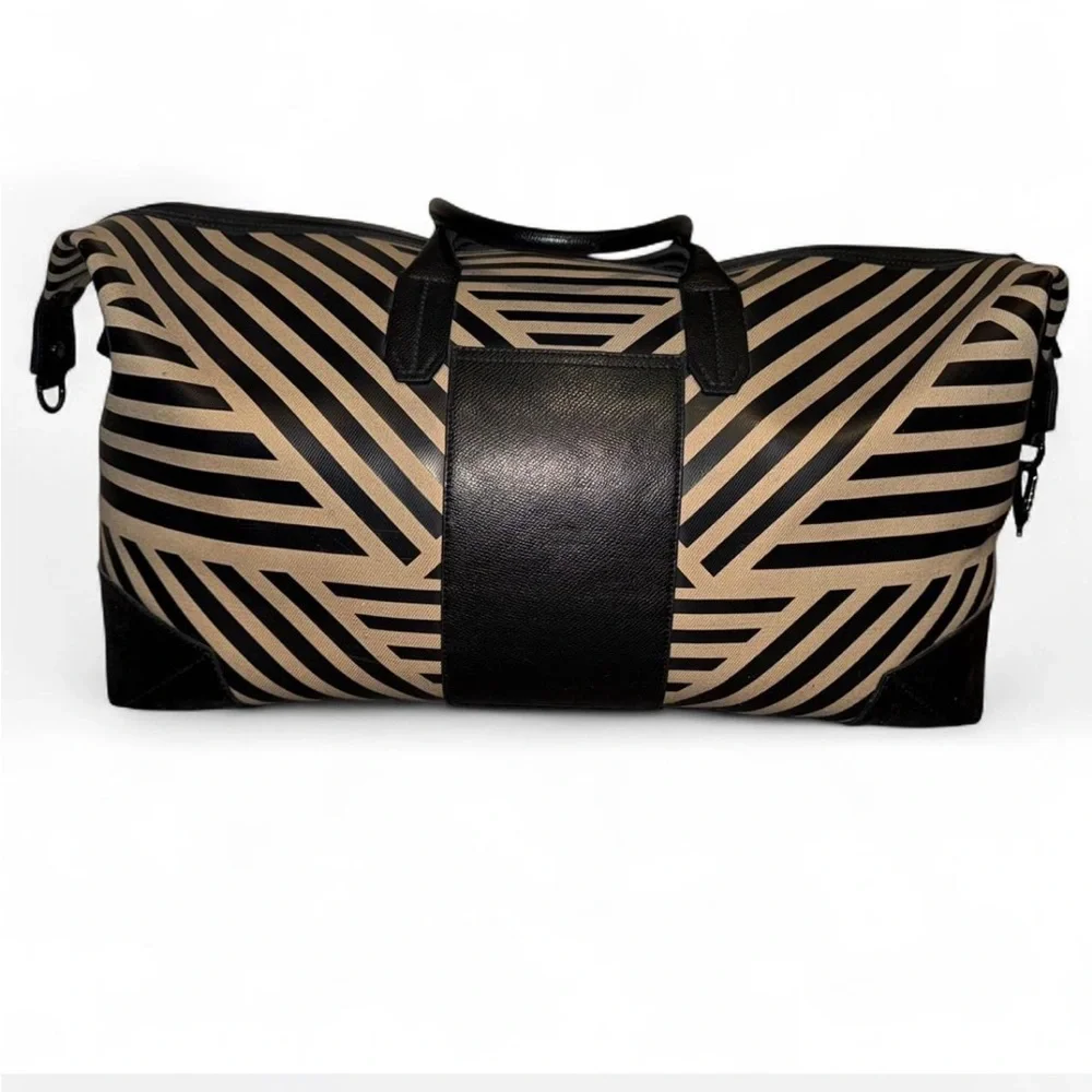Uri Minkoff tan and black leather geometric design travel bag